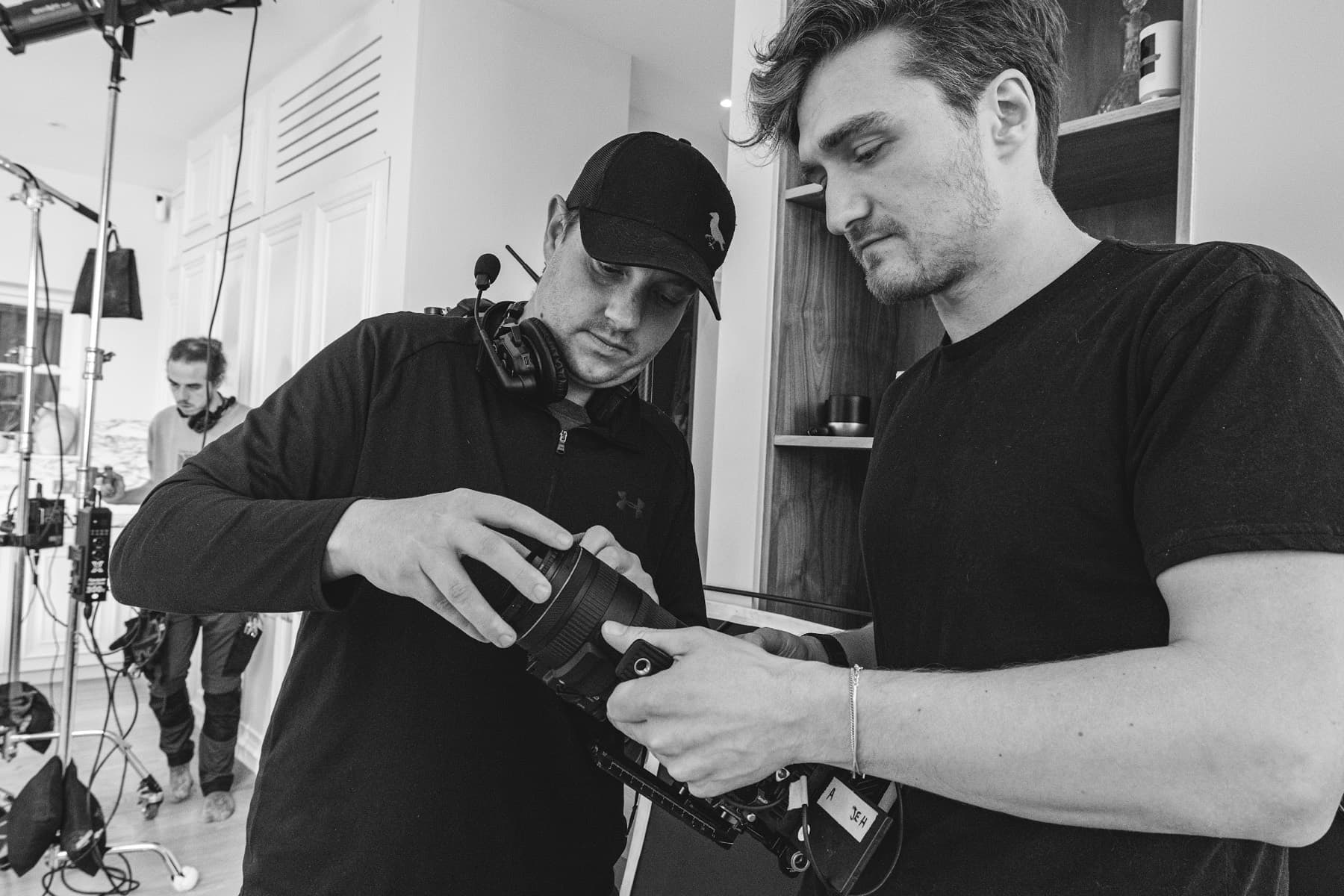 Two of the crew building a camera package before a shoot