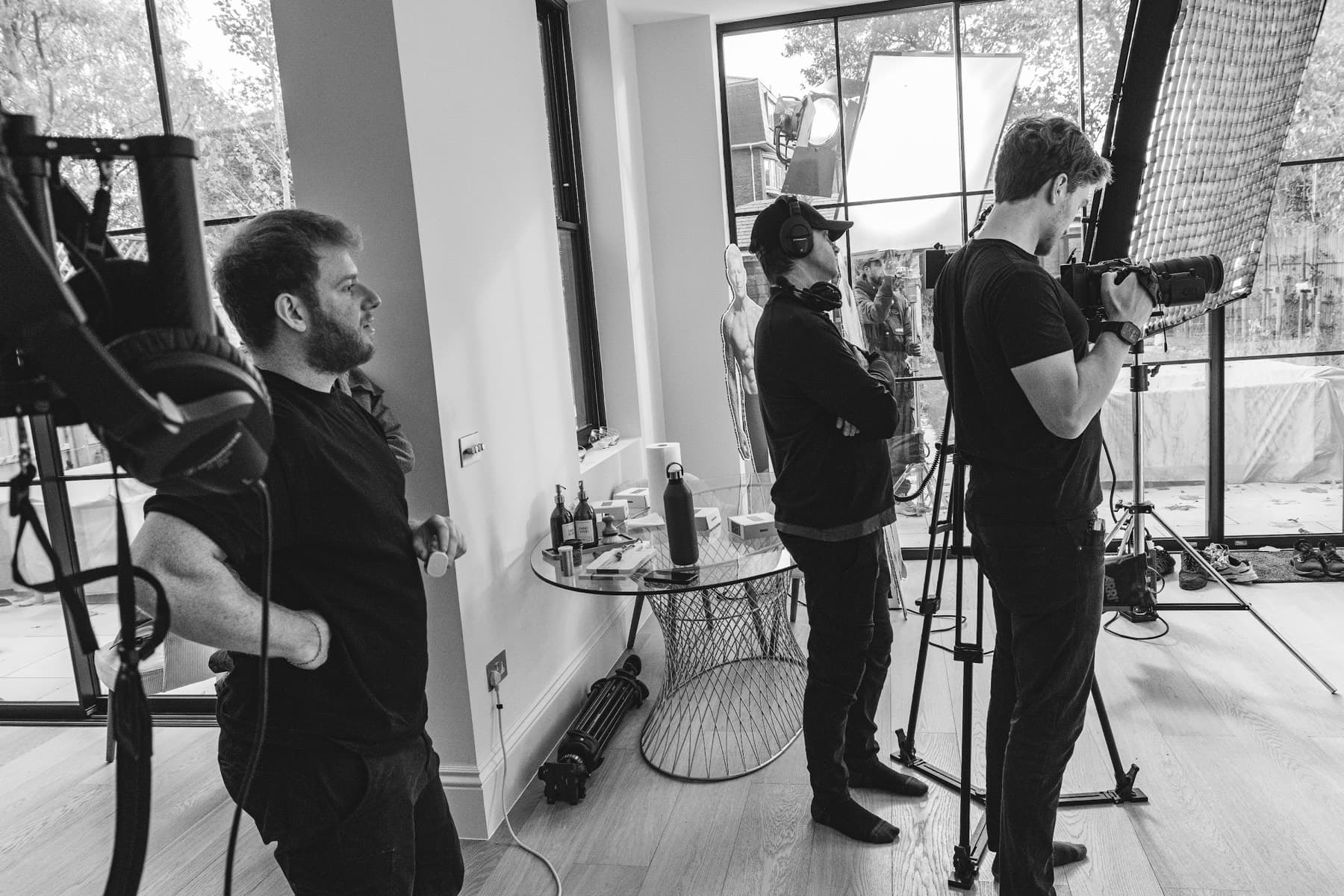 Flowspire crew on location — lighting and camera set up in a window-lit room