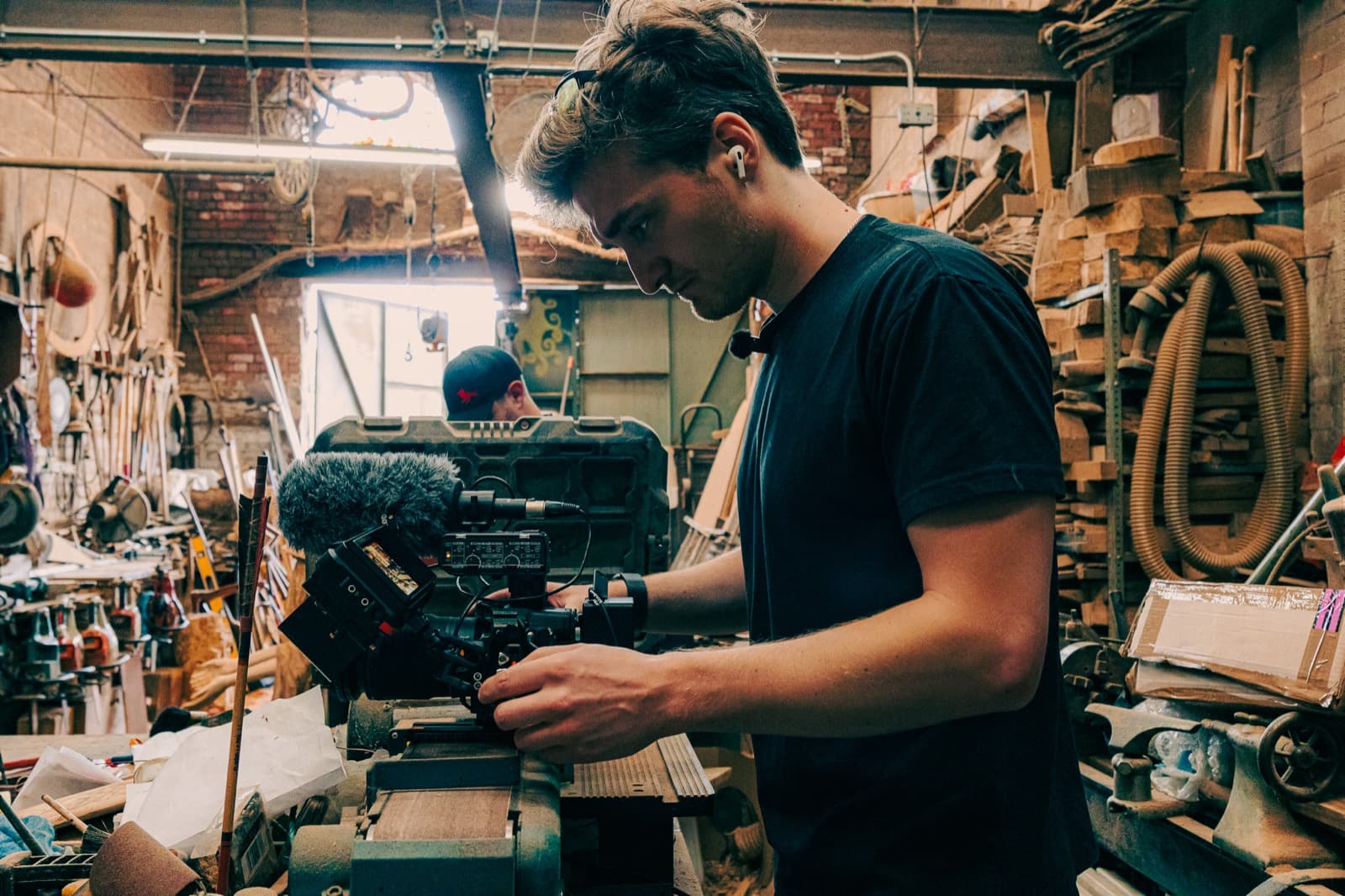 Filming in a workshop, camera in among the tools