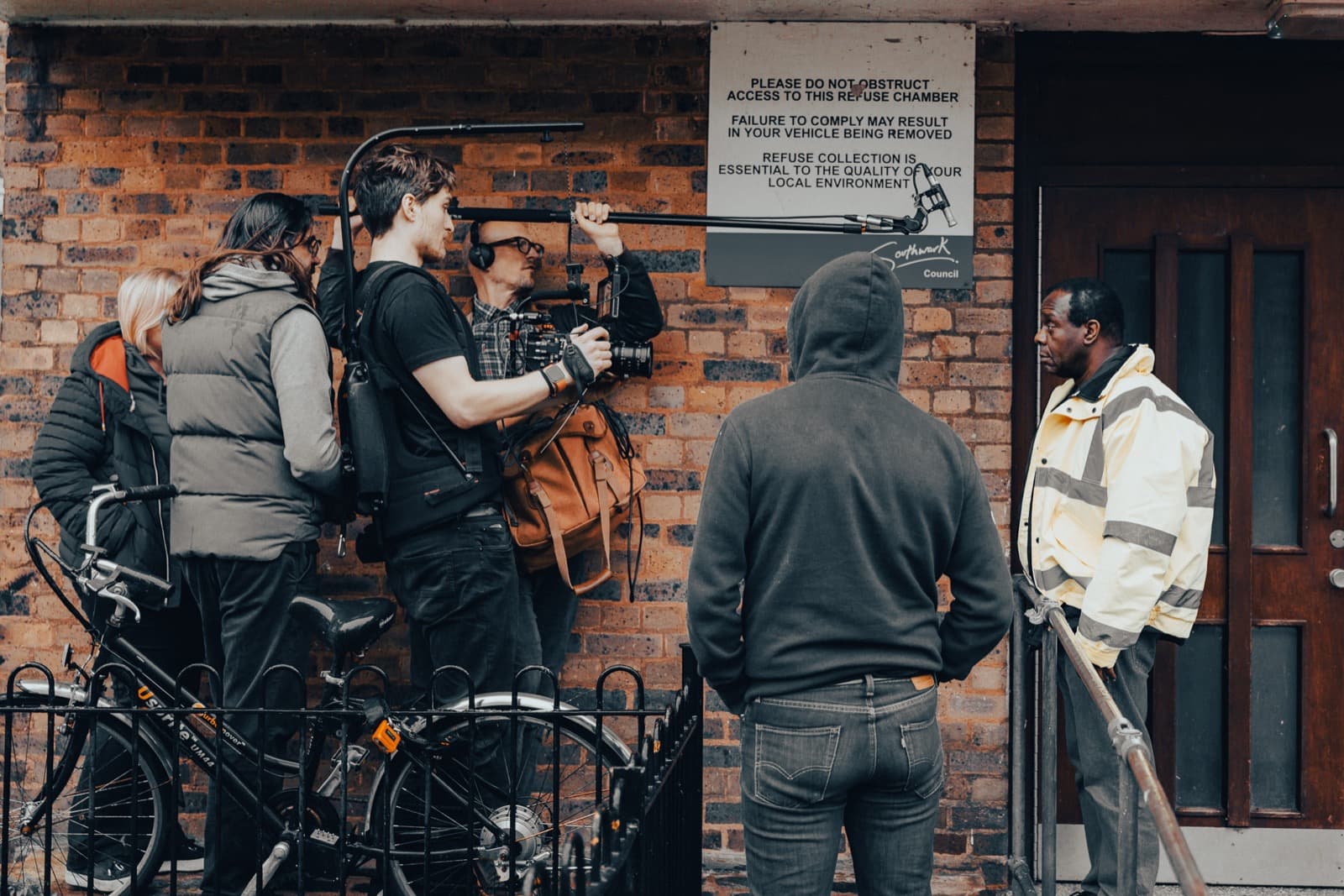 A shoot set up in a doorway, camera and lighting in position