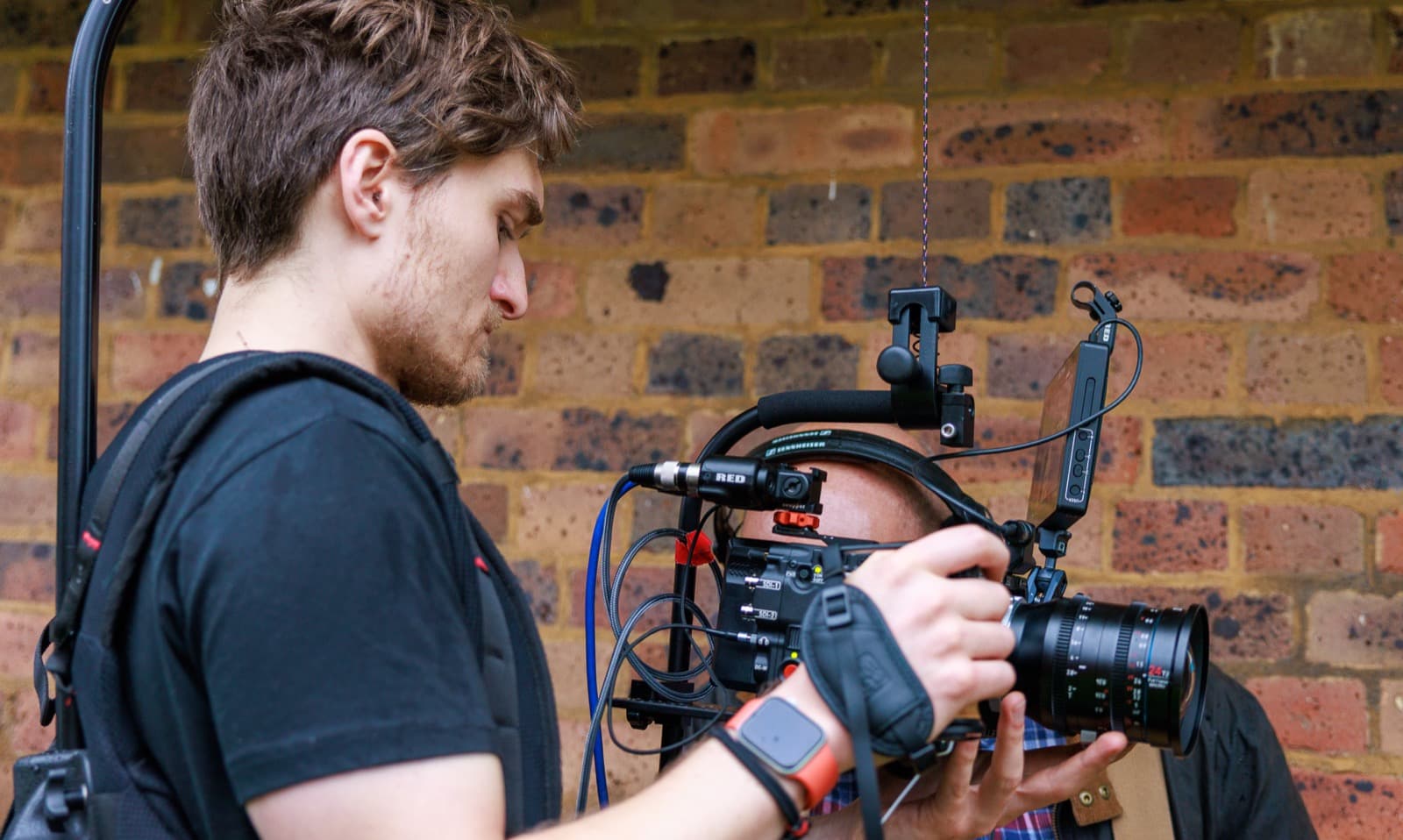 A camera built up on the shoulder, waiting on the next set-up