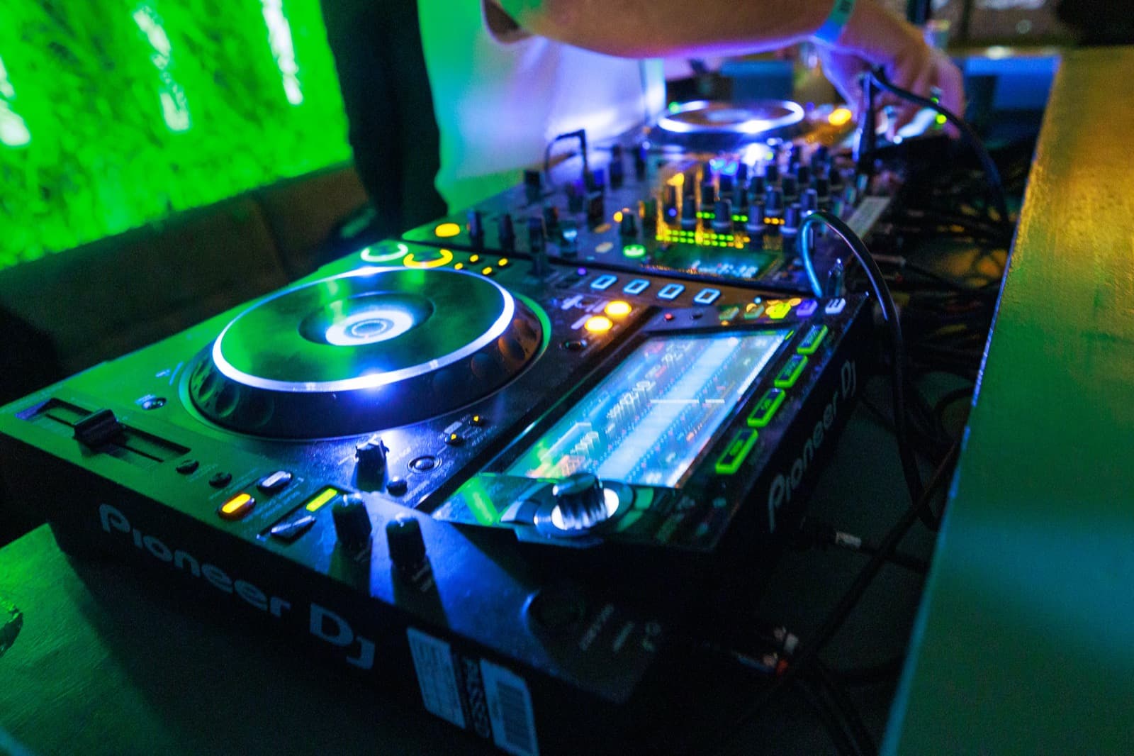 The decks mid-set, lit green